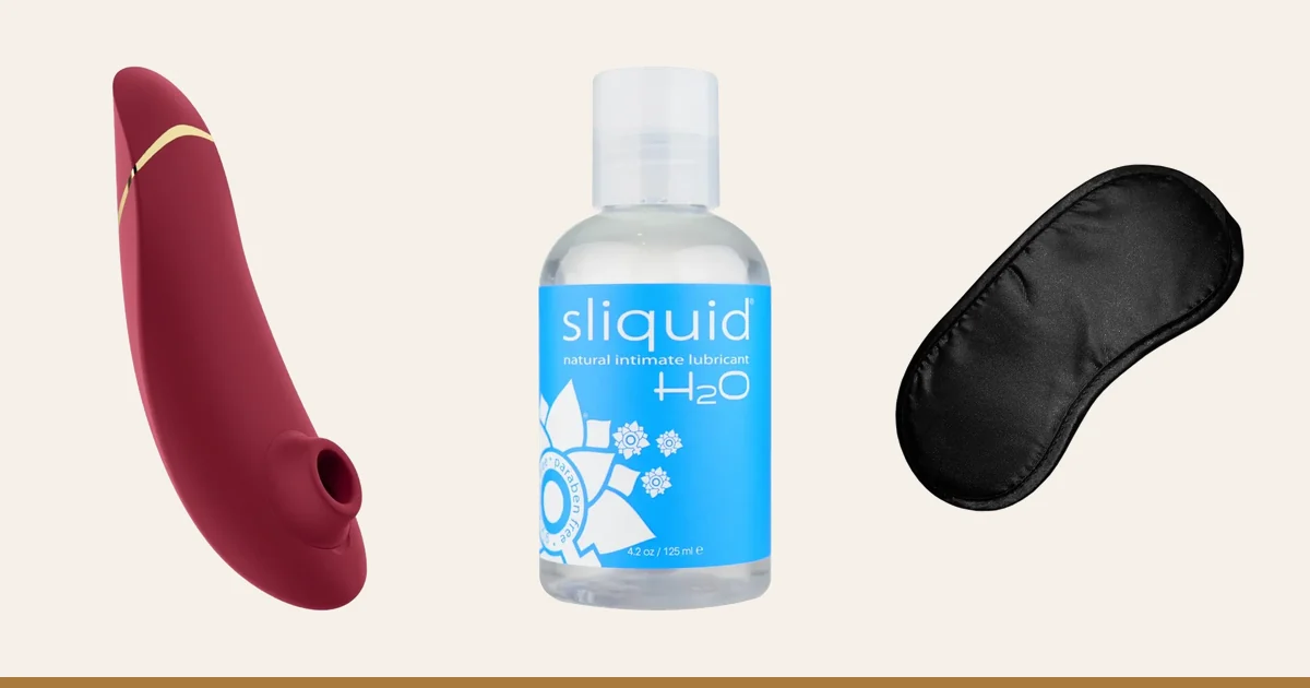Womanizer Premium 2, Sliquid H2O and a satin blindfold.