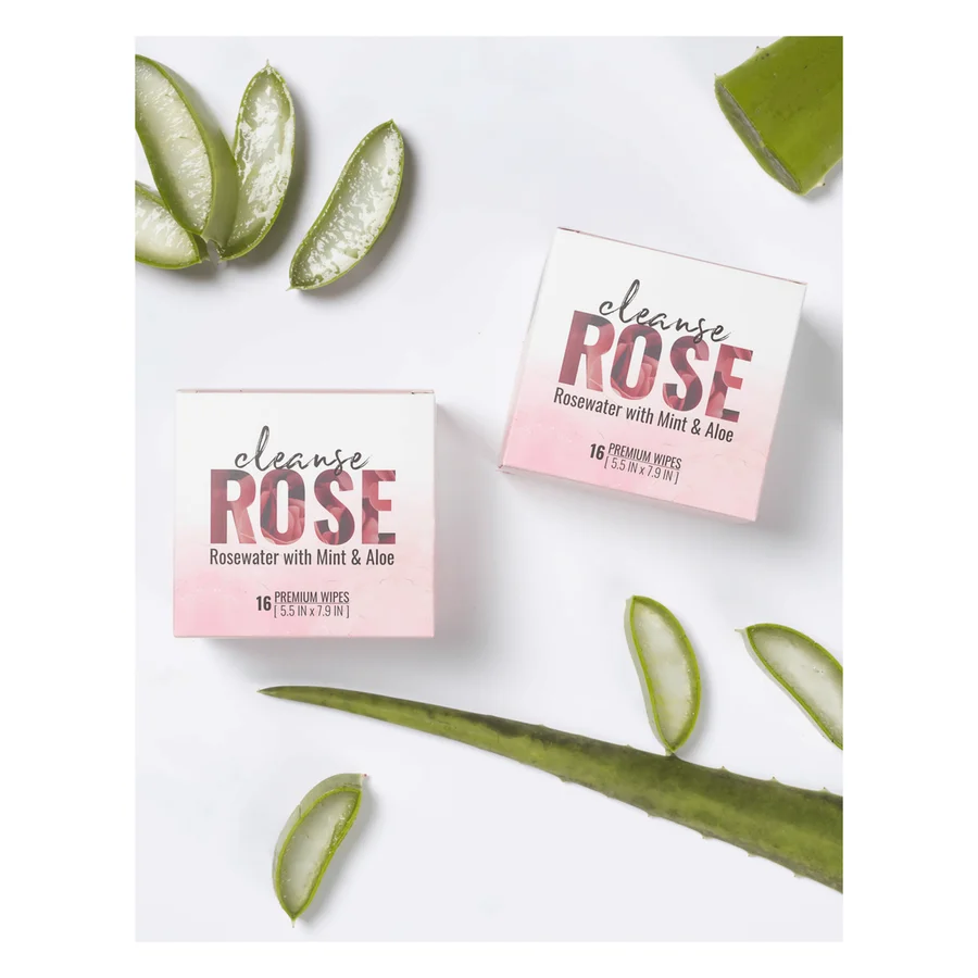 Alchemy Cleanse Rosewater body wipes, two pink packs among fresh aloe leaves.