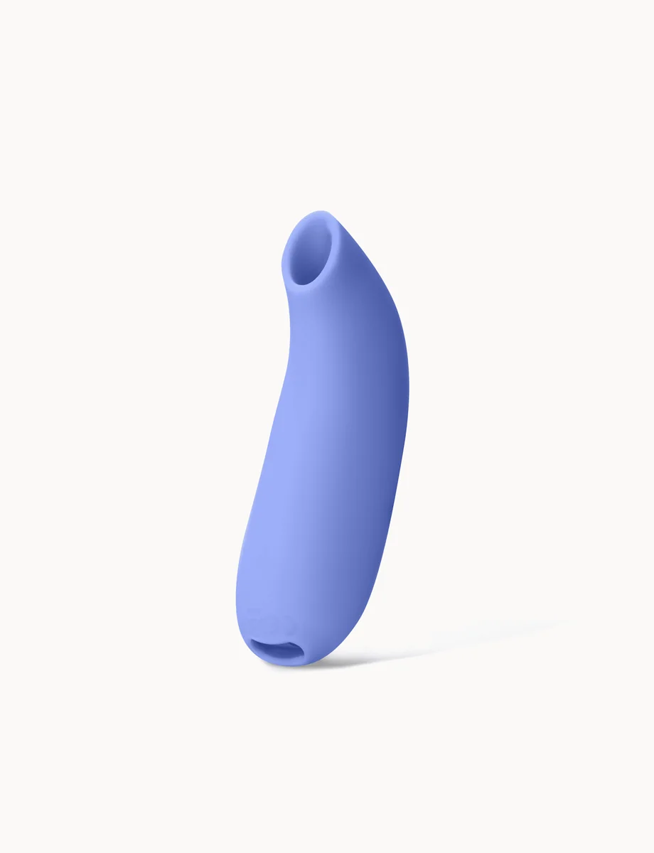 Official Dame Aer. Compact air-pulse stimulator on a light background.