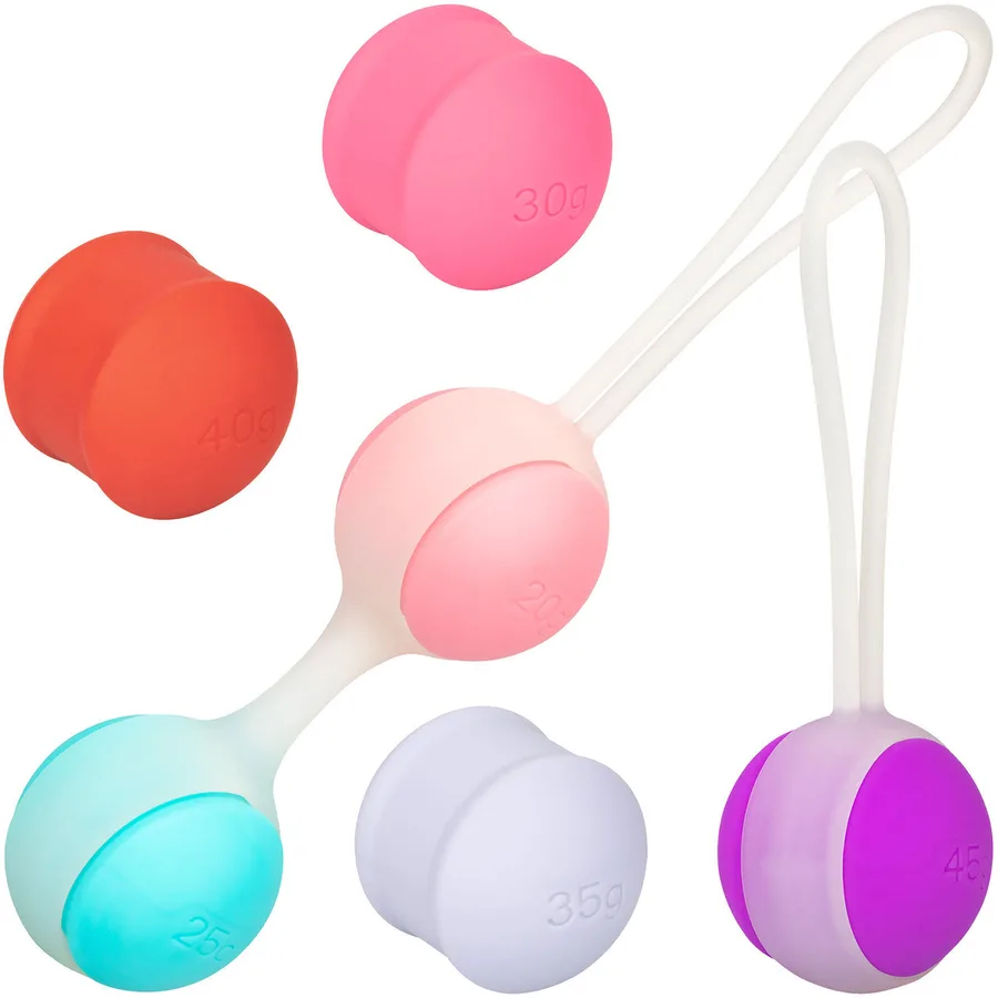 She-ology interchangeable weighted kegel set with six colored weights and two silicone holders.