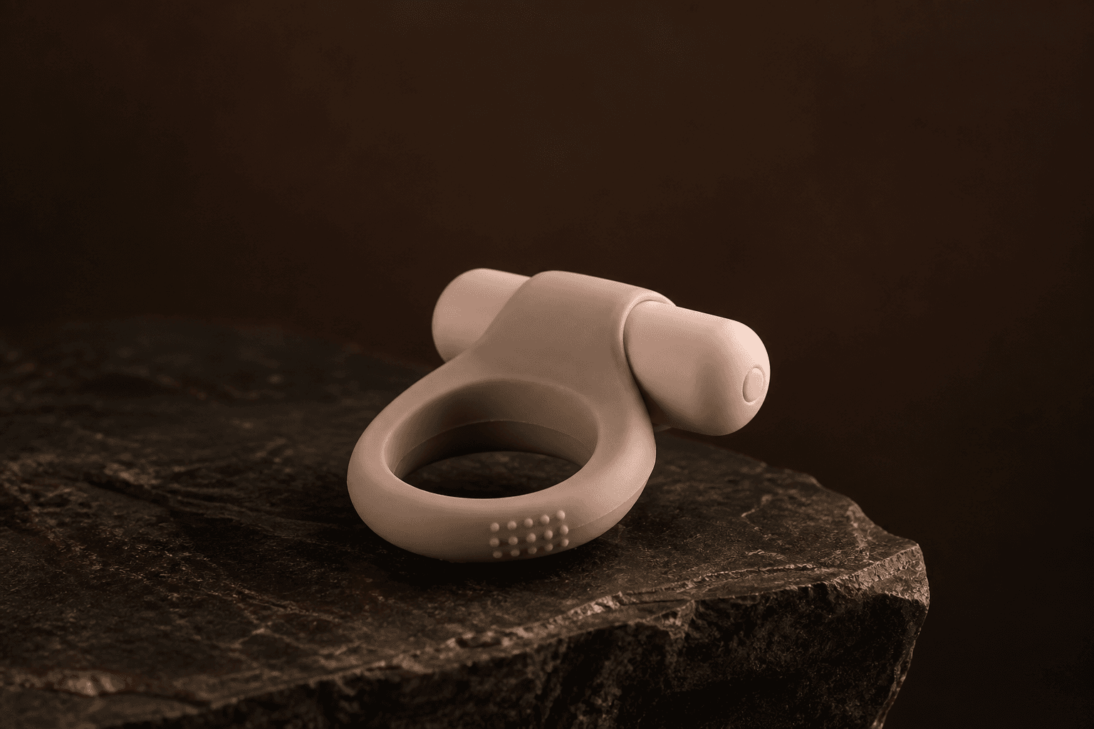 Studio shot of a stretchy ring on dark linen. Stand-in for LELO Tor 3.
