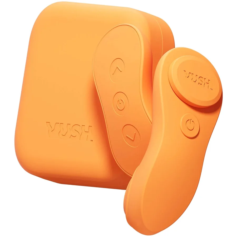 VUSH Luna wearable panty vibrator in orange silicone with its remote.