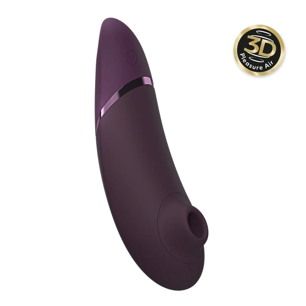Official Womanizer Next in aubergine. Slim air-pulse stimulator on white.